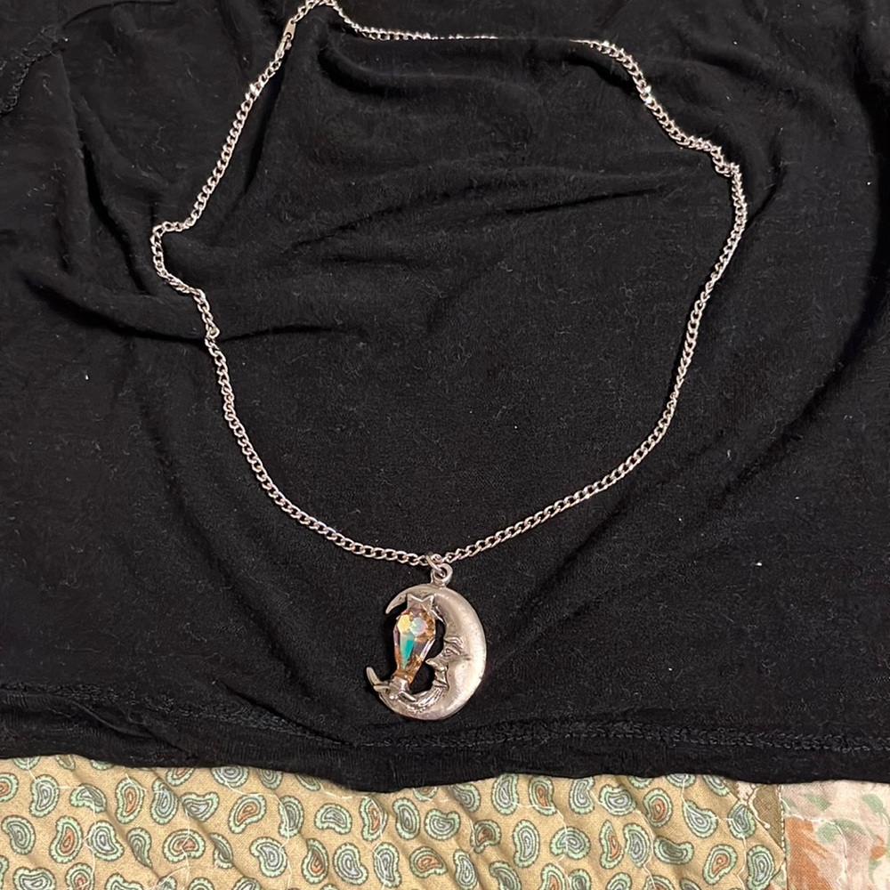 Man in the half moon necklace